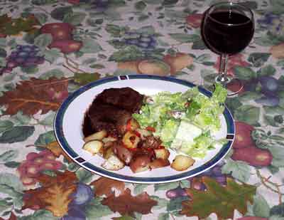 steak, salad, and vegetables